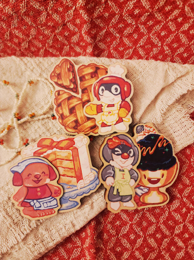 A close-up of the wooden magnets I designed for Cherry Rush 2026.