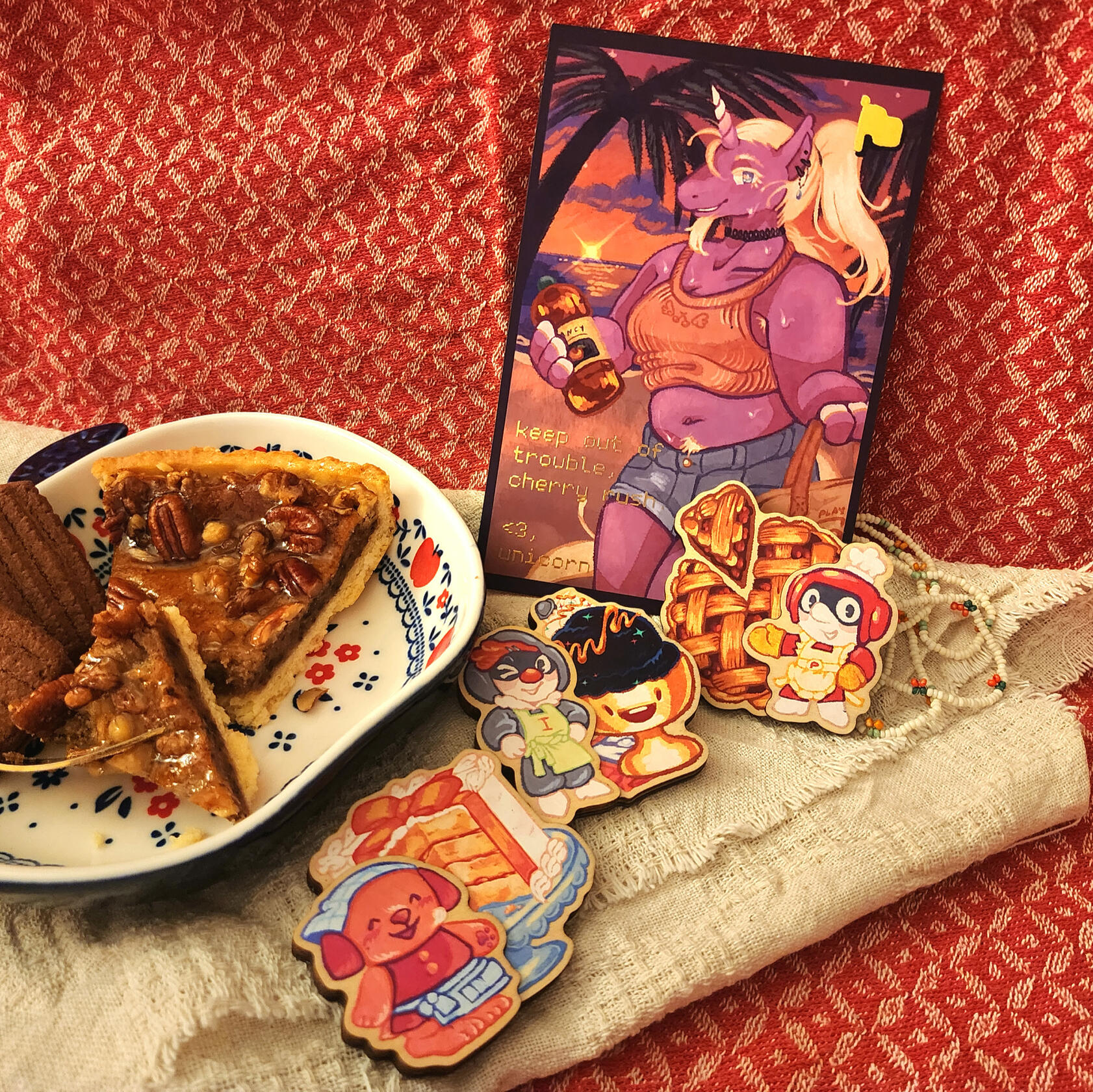 A spread of the foil-embossed postcard and wooden magnet set I designed for Cherry Rush 2026, a charity marathon event benefiting Partners in Health.